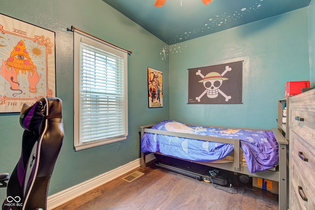 120 W S St, Tipton, IN 46072 - bedroom with baseboards, ceiling fan, visible vents, and wood finished floors