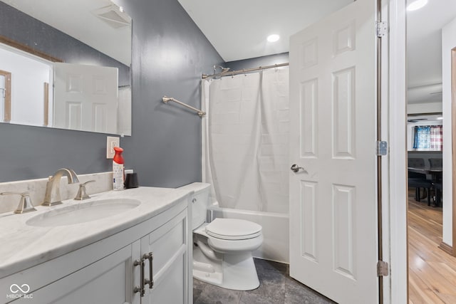 bathroom featuring shower / bath combination with curtain, toilet, visible vents, and vanity