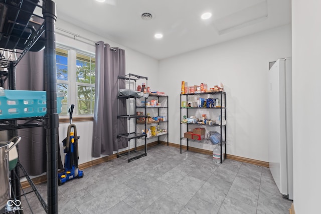 interior space with baseboards, recessed lighting, and visible vents