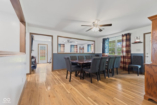 dining room with light wood-type flooring and ceiling fan