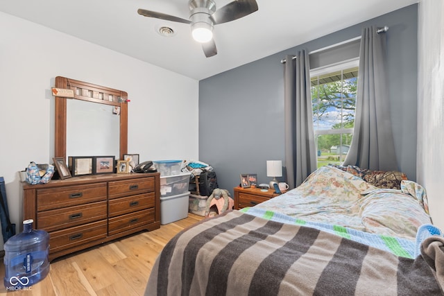 bedroom featuring ceiling fan and light wood-style floors