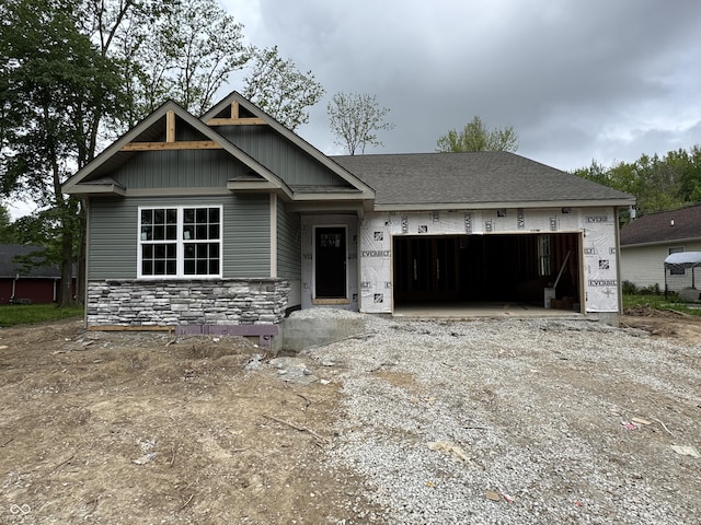 542 Mill Spgs, Coatesville, IN 46121 - view of front of property featuring a garage, driveway, and stone siding