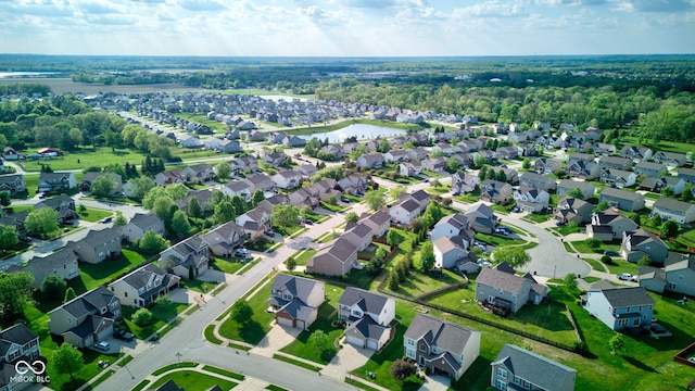 aerial overview of property's location with nearby suburban area and a nearby body of water