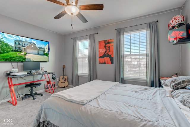carpeted bedroom with baseboards and ceiling fan