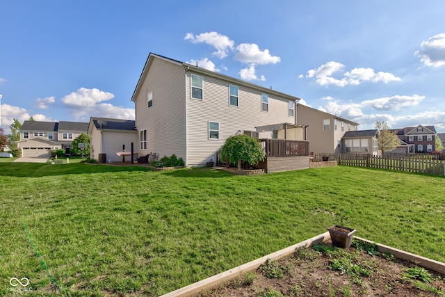 rear view of house with a residential view and a deck