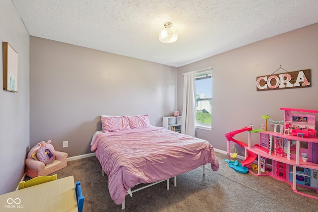 carpeted bedroom featuring baseboards and a textured ceiling