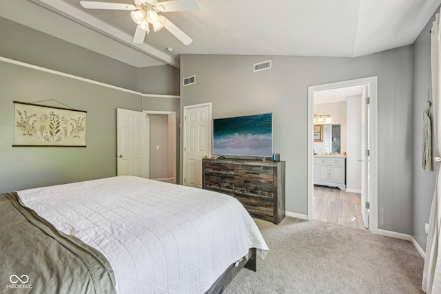 bedroom featuring carpet floors, baseboards, vaulted ceiling, and visible vents