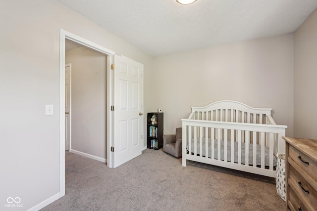 carpeted bedroom with baseboards