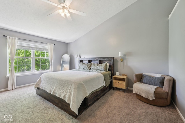 bedroom featuring carpet floors, baseboards, and lofted ceiling