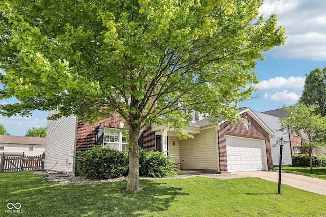 obstructed view of property with fence, concrete driveway, a front yard, and brick siding