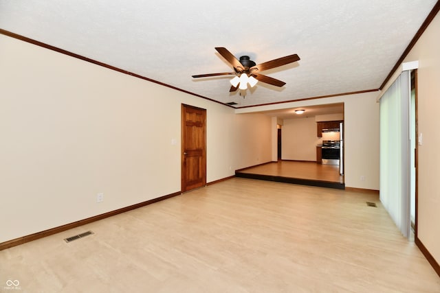 12087 N Gasburg Rd, Mooresville, IN 46158 - unfurnished room featuring a ceiling fan, crown molding, light wood-style floors, and a textured ceiling