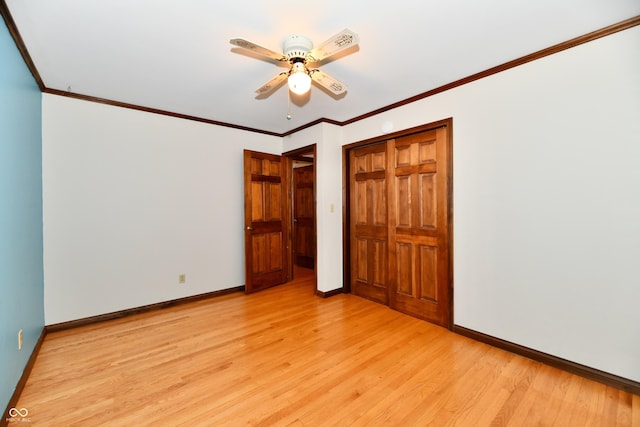 12087 N Gasburg Rd, Mooresville, IN 46158 - unfurnished bedroom with light wood-style floors, a closet, crown molding, and ceiling fan