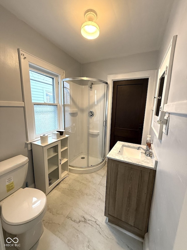 324 E Southern Ave, Indianapolis, IN 46225 - bathroom featuring a stall shower, vanity, and toilet