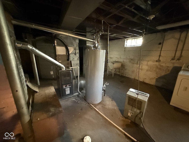 324 E Southern Ave, Indianapolis, IN 46225 - below grade area featuring water heater, washer / clothes dryer, and a sink