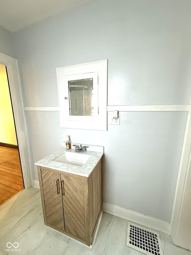 324 E Southern Ave, Indianapolis, IN 46225 - bathroom with vanity and baseboards