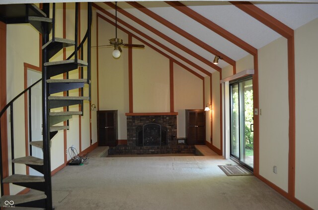931 Beech Dr, Greenwood, IN 46142 - unfurnished living room featuring a brick fireplace, beam ceiling, carpet floors, high vaulted ceiling, and stairs
