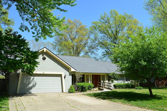 931 Beech Dr, Greenwood, IN 46142 - single story home featuring a garage, a front yard, roof with shingles, stucco siding, and driveway