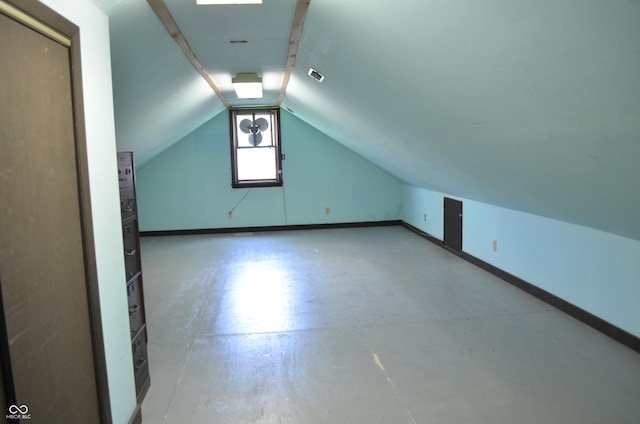 931 Beech Dr, Greenwood, IN 46142 - bonus room with baseboards, vaulted ceiling, concrete floors, and visible vents