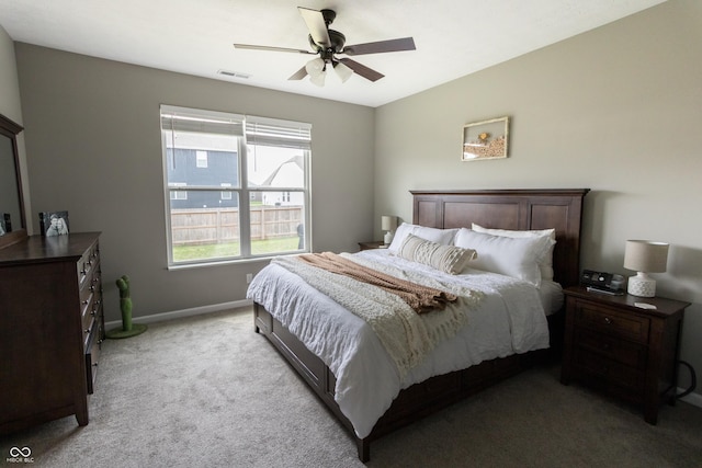 bedroom with baseboards, ceiling fan, light carpet, and visible vents