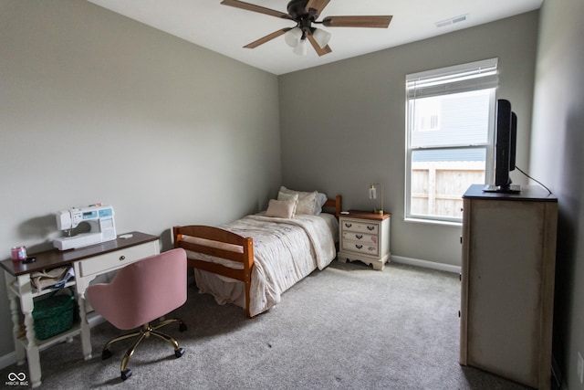 bedroom with ceiling fan, visible vents, and carpet