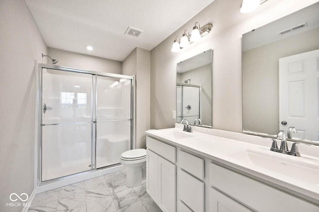 bathroom featuring visible vents, a sink, marble finish floor, and a stall shower