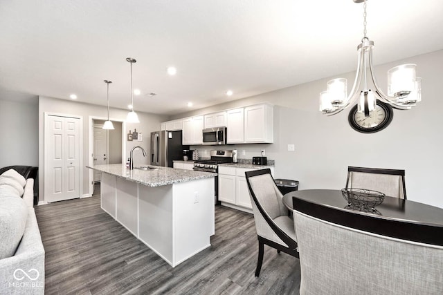 kitchen featuring a chandelier, appliances with stainless steel finishes, a sink, and recessed lighting
