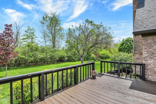 wooden terrace with a yard