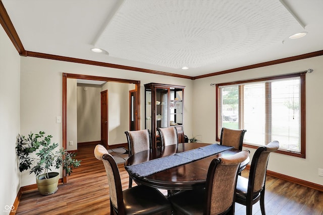dining area with crown molding, recessed lighting, baseboards, and wood finished floors