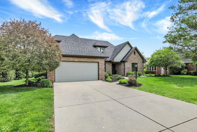 view of front of house with a garage, a front yard, brick siding, and driveway