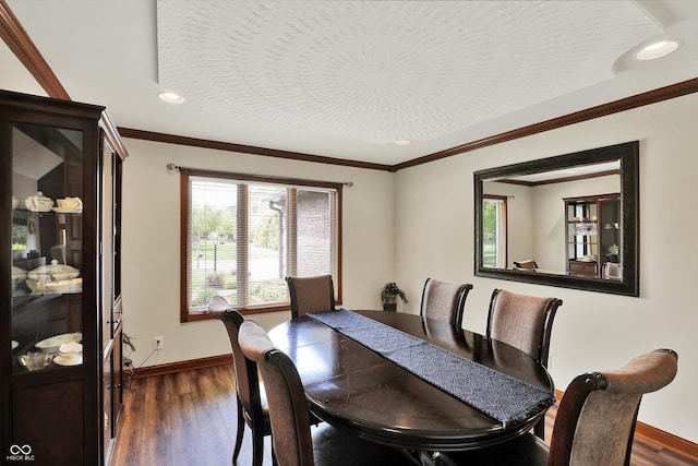 dining room featuring crown molding, baseboards, dark wood-type flooring, and recessed lighting