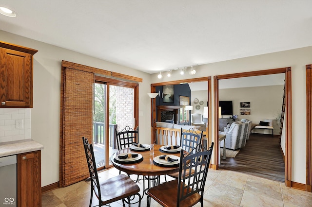 dining area featuring baseboards