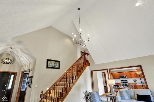 interior space with a chandelier and high vaulted ceiling