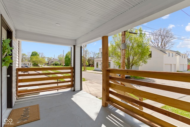 view of patio / terrace with a porch and a residential view
