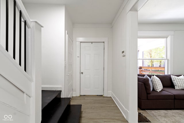 corridor with light wood-type flooring