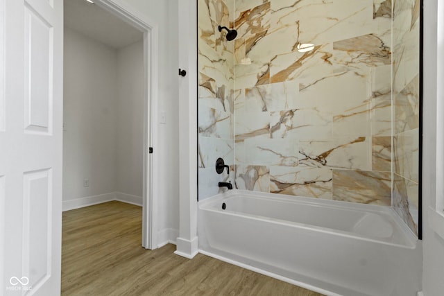 full bathroom with shower / bathtub combination, baseboards, and wood finished floors