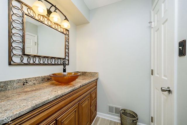 162 Carmelaire Dr, Carmel, IN 46032 - bathroom featuring vanity, baseboards, and wood finished floors