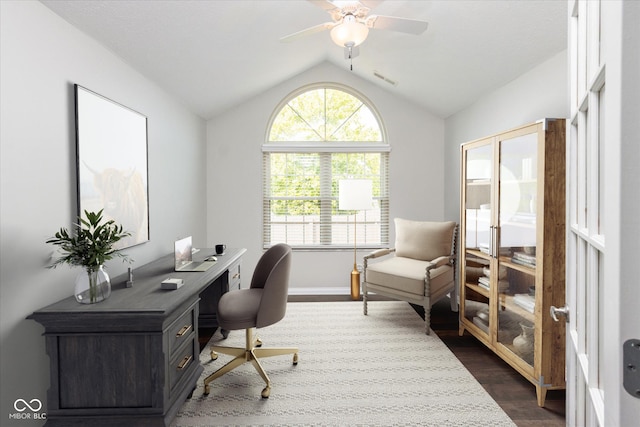 office area featuring vaulted ceiling, dark wood-type flooring, ceiling fan, and baseboards