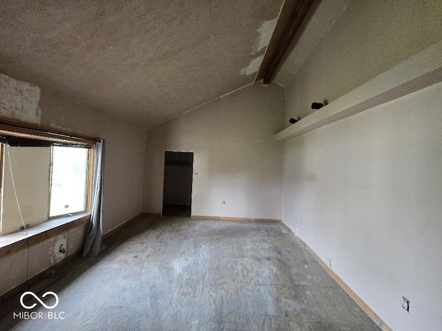1354 Roache St, Indianapolis, IN 46208 - unfurnished room with vaulted ceiling with beams, a textured ceiling, and baseboards