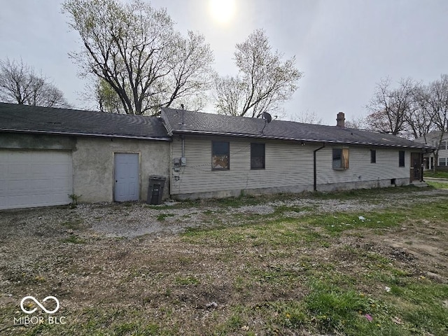 1354 Roache St, Indianapolis, IN 46208 - back of house featuring an attached garage