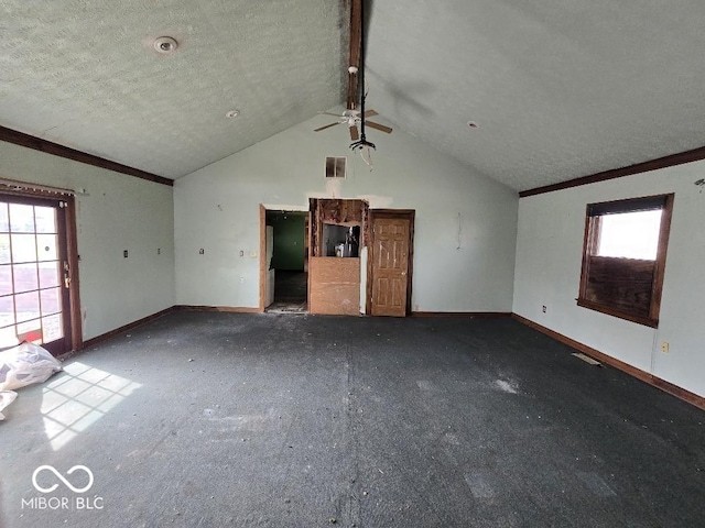 1354 Roache St, Indianapolis, IN 46208 - unfurnished living room featuring a ceiling fan, baseboards, lofted ceiling, and a textured ceiling