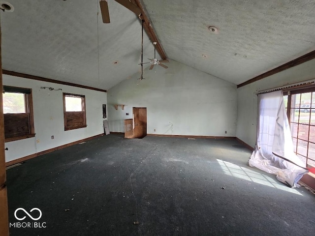 1354 Roache St, Indianapolis, IN 46208 - unfurnished living room with plenty of natural light, baseboards, ceiling fan, and lofted ceiling with beams