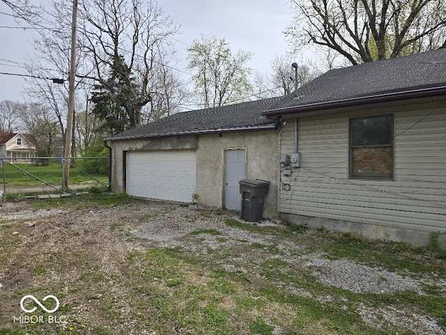 1354 Roache St, Indianapolis, IN 46208 - view of side of property with fence and a garage