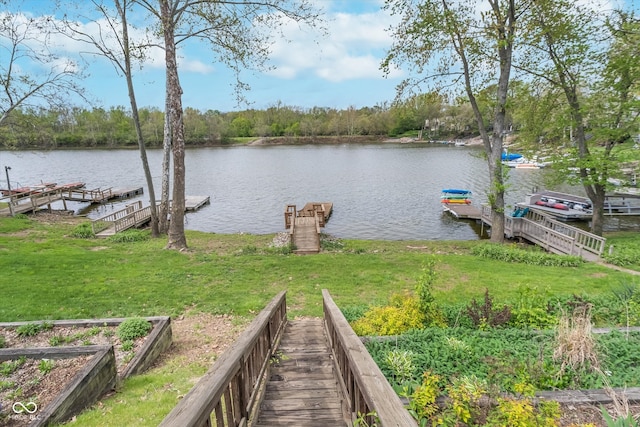 dock area featuring a yard and a water view