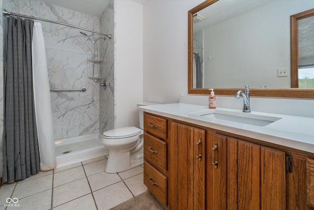 bathroom with vanity, a shower with curtain, toilet, and tile patterned floors