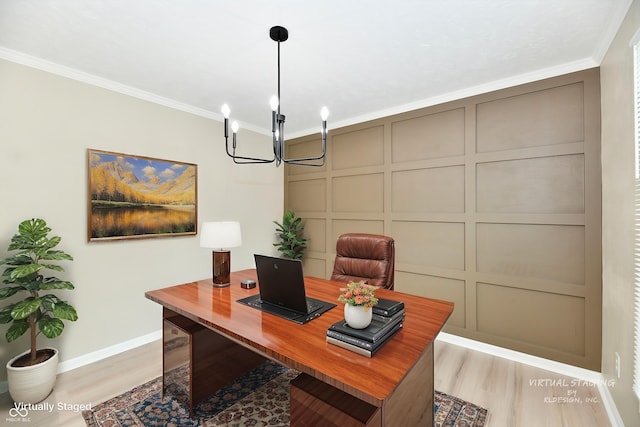 office with a decorative wall, a chandelier, baseboards, wood finished floors, and ornamental molding
