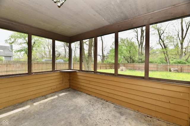 unfurnished sunroom featuring plenty of natural light