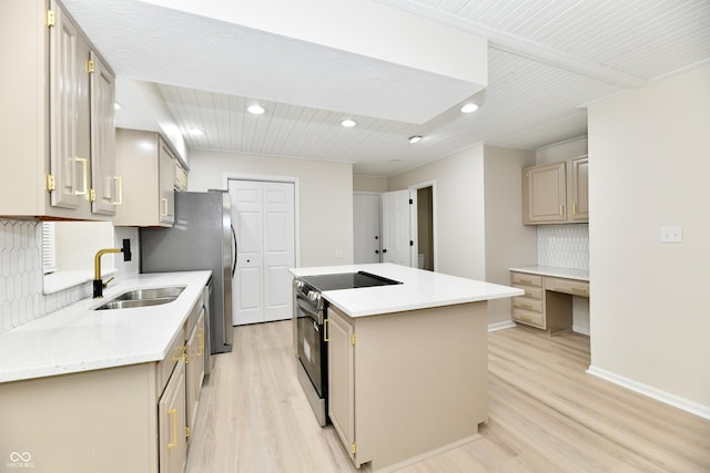 kitchen with a sink, light wood finished floors, black electric range oven, tasteful backsplash, and a kitchen island