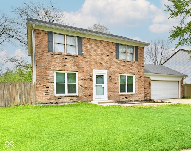 colonial home with fence, an attached garage, and brick siding