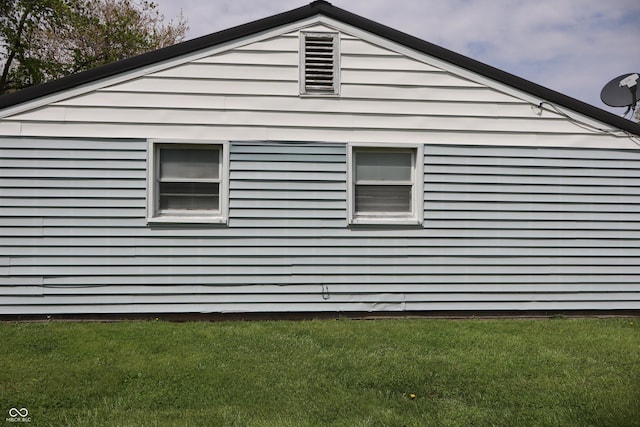 view of property exterior featuring a yard