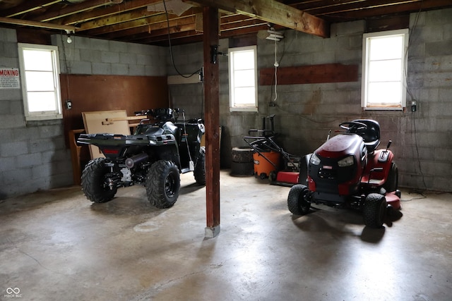 below grade area with a healthy amount of sunlight and a garage